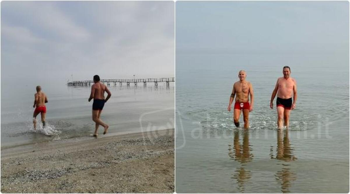 Bagno di inizio anno, anche i runner di Misano Podismo sfidano il mare freddo - Pasquale Giorgione (costume rosso) e Antonio Pepe di Misano Podismo